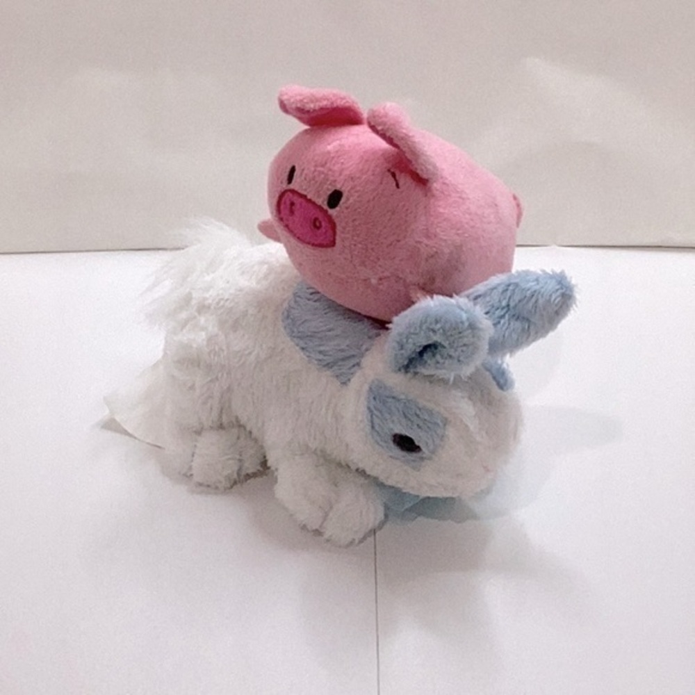 Bun Bun pig and blue rabbit stuffed animal